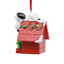 Load image into Gallery viewer, Peanuts® Snoopy on Holiday Doghouse Hallmark Ornament
