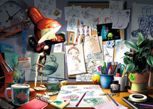 Load image into Gallery viewer, Disney Pixar: The Artist&#39;s Desk - 1000 Piece Puzzle By Ravensburger
